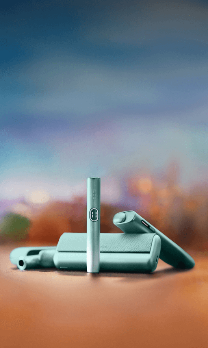 woman holding an IQOS gift box